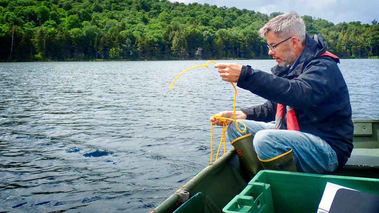 Stephen Jane deploys a sensor in an Adirondack lake.