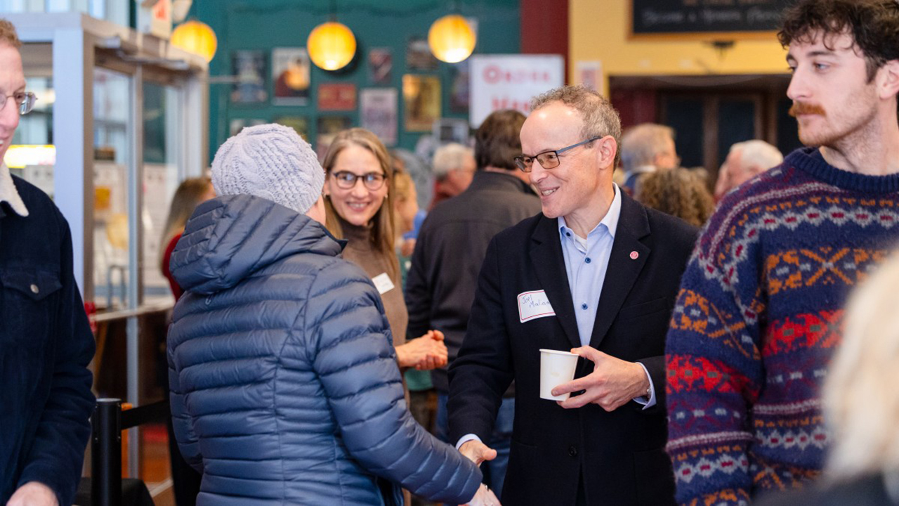 Joel M. Malina greets guests at the awards.