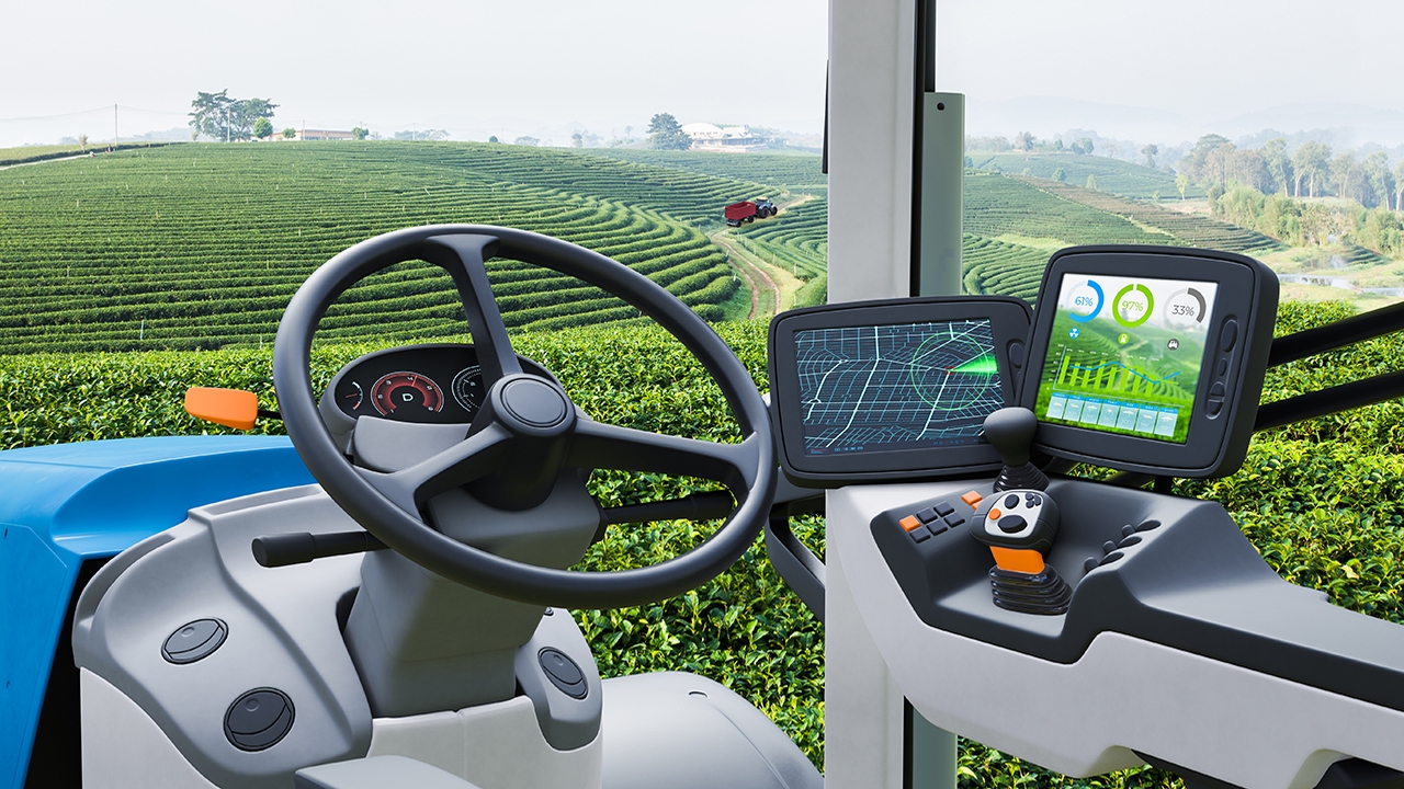 A digital rendering of the inside of a farm machinery cockpit.